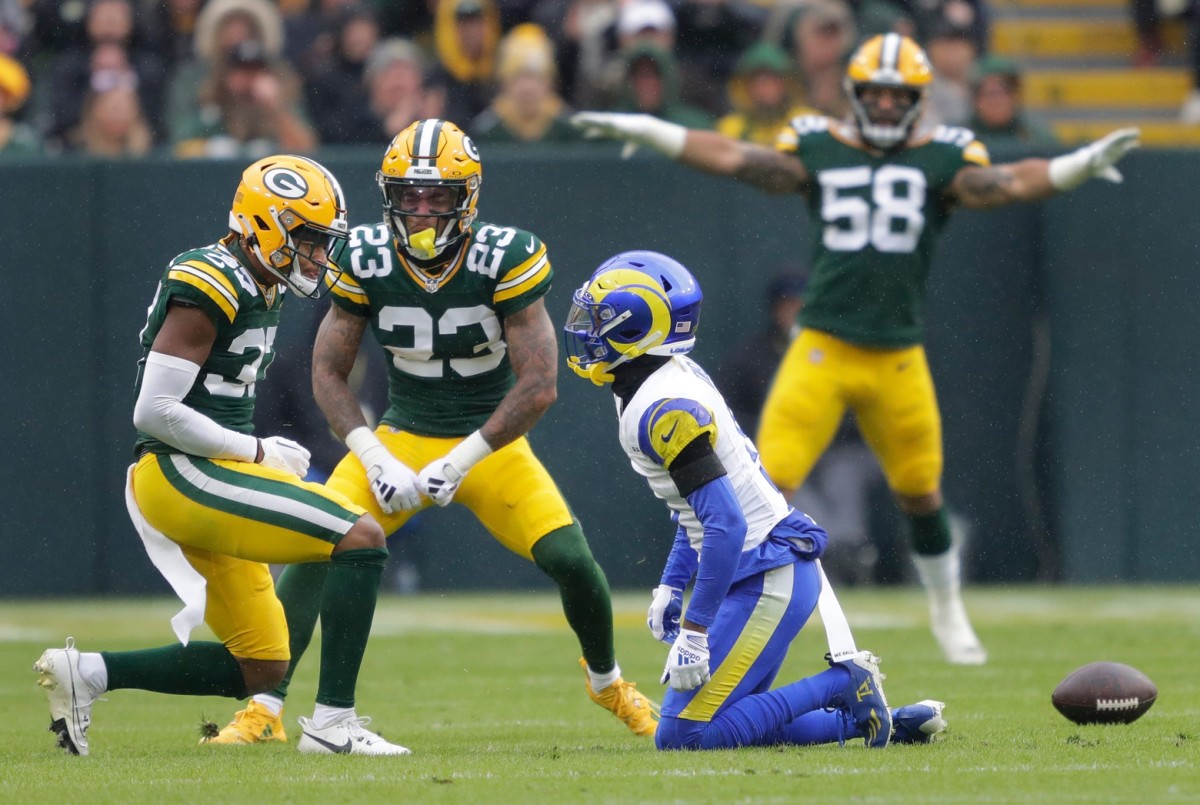 Green Bay Packers cornerback Carrington Valentine (37) stares at Los Angeles Rams wide receiver Tutu Atwell (5) after breaking up a pass attempt during their football game Sunday, November 5, 2023, at Lambeau Field in Green Bay, Wis.