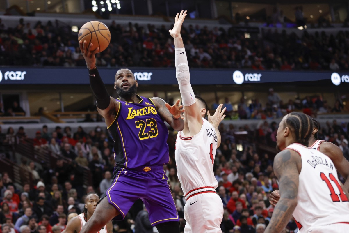 Los Angeles Lakers forward LeBron James (23) goes to the basket against Chicago Bulls center Nikola Vucevic (9) during the second half at United Center. 