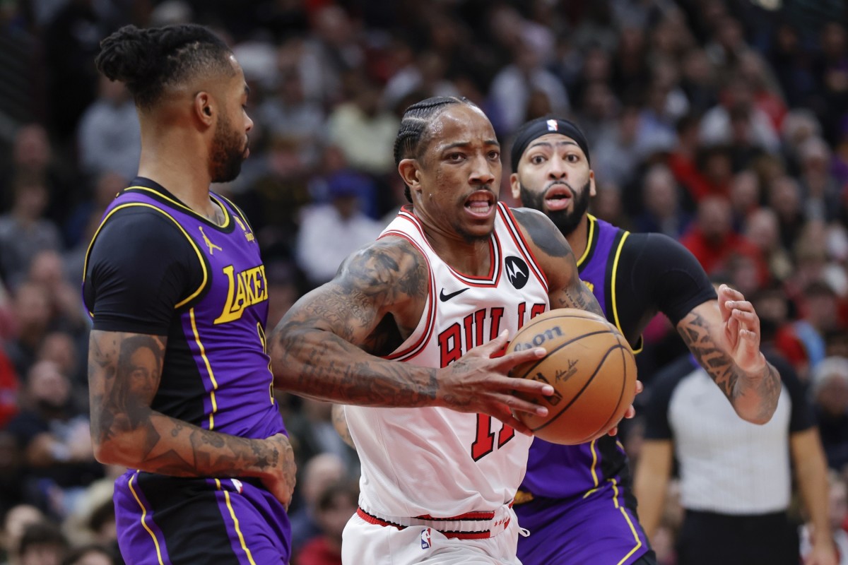 Chicago Bulls forward DeMar DeRozan (11) drives to the basket against Los Angeles Lakers guard D'Angelo Russell (1) during the first half at United Center. 