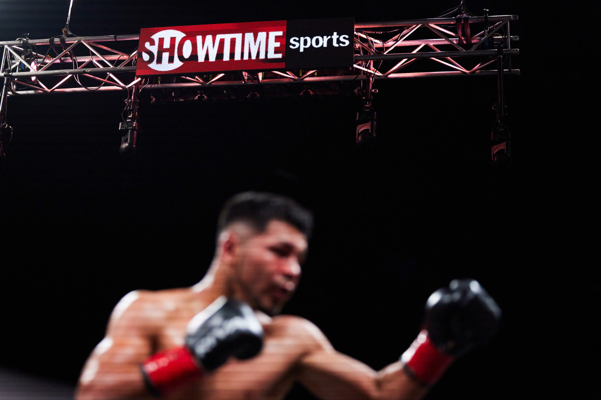 A boxer warms up under a Showtime Sports sign.