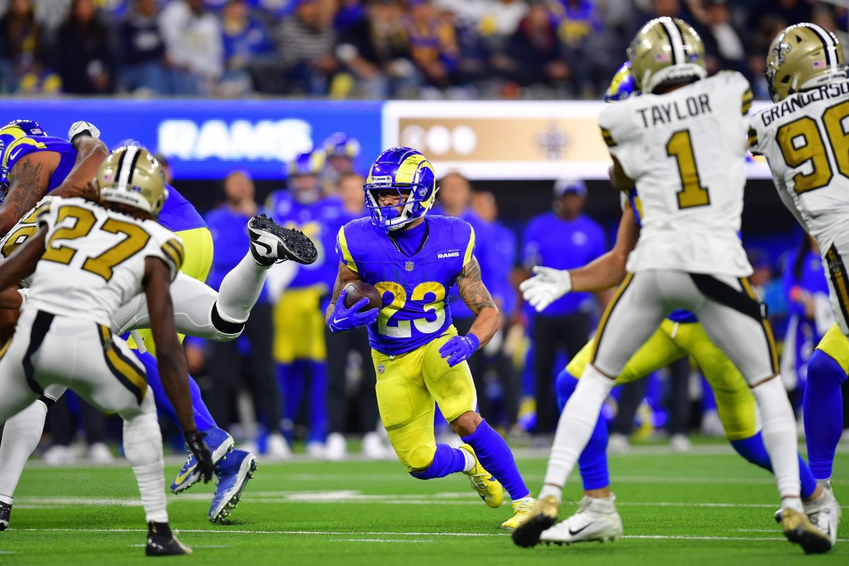 Los Angeles Rams running back Kyren Williams (23) runs the ball against the New Orleans Saints. Mandatory Credit: Gary A. Vasquez-USA TODAY Sports