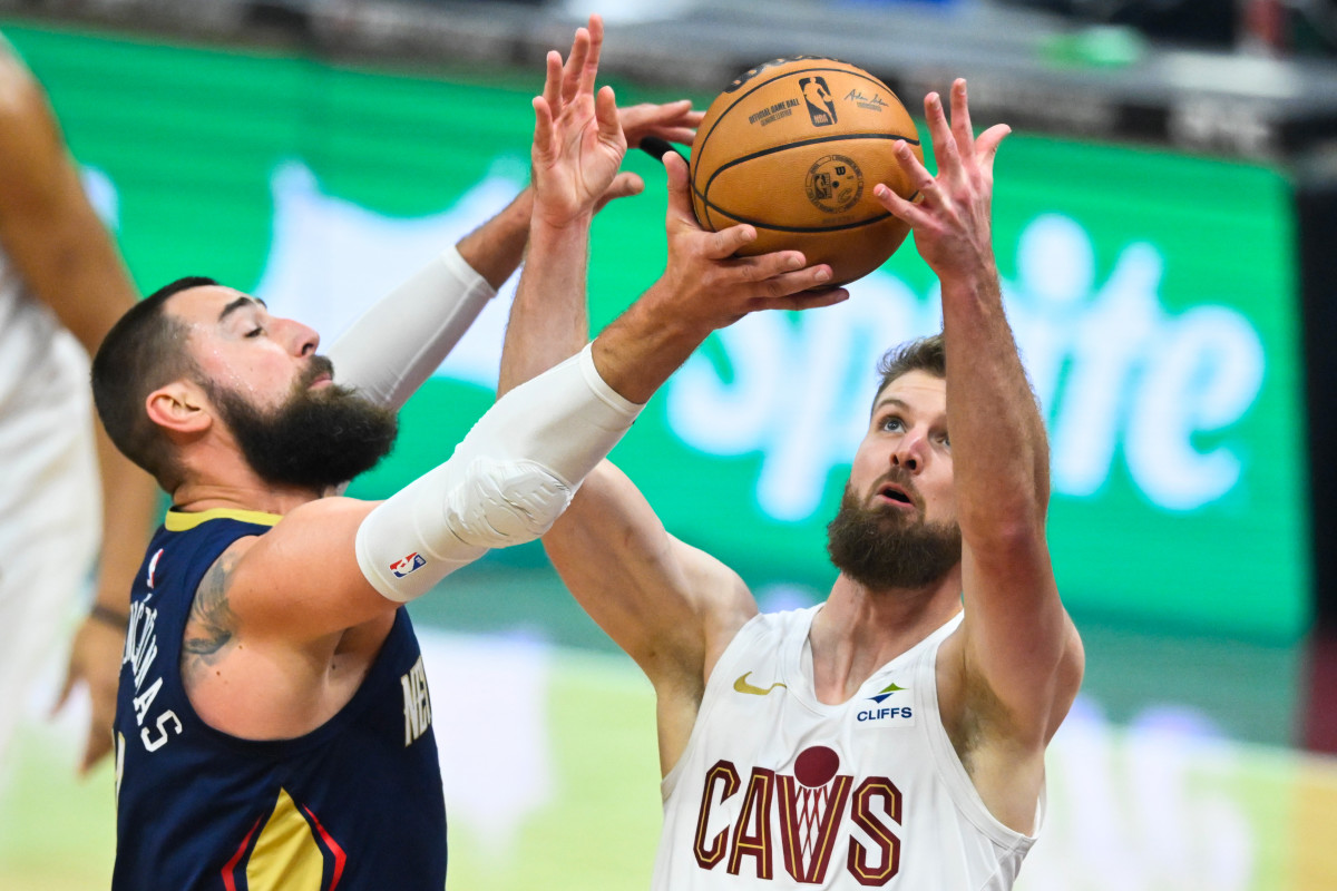 Dec 21, 2023; Cleveland, Ohio, USA; New Orleans Pelicans center Jonas Valanciunas (17) and Cleveland Cavaliers forward Dean Wade (32) contest a rebound in the first quarter at Rocket Mortgage FieldHouse.
