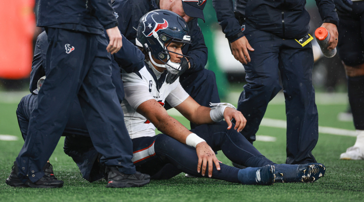 Houston Texans quarterback C.J. Stroud sits on the ground after suffering an injury against the New York Jets.