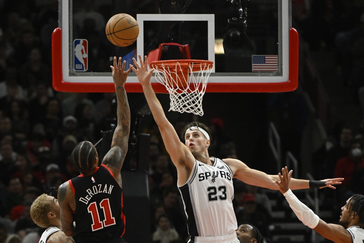 San Antonio Spurs forward Zach Collins (23) defends against Chicago Bulls forward DeMar DeRozan (11) during the second half at the United Cente