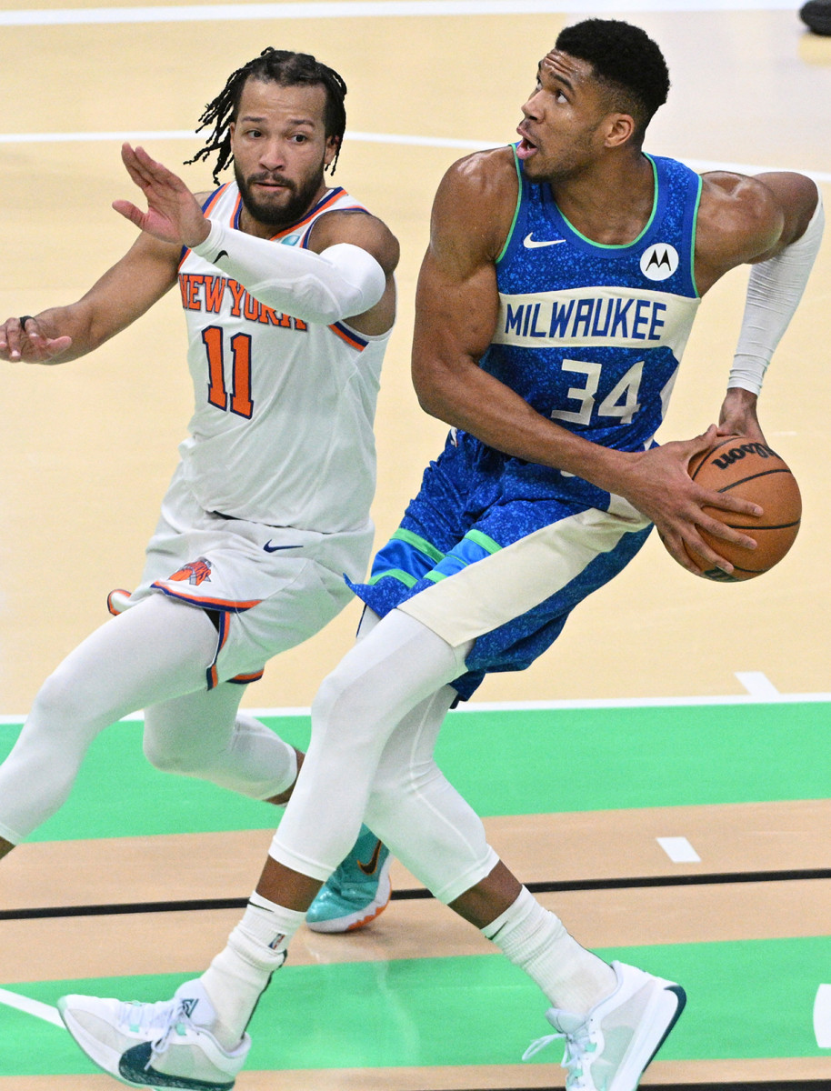 Knicks’ Jalen Brunson defends Bucks’ Giannis Antetokounmpo.