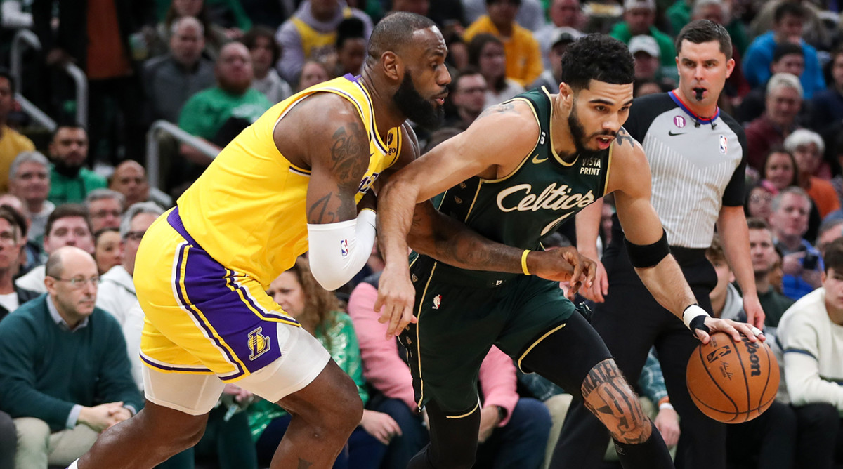 Lakers’ LeBron James tries to steal the ball from Celtics’ Jayson Tatum.
