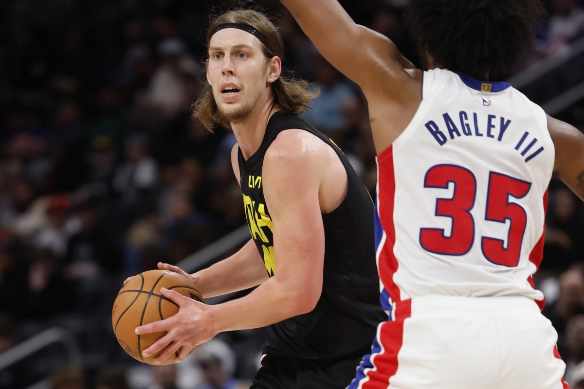 Dec 21, 2023; Detroit, Michigan, USA; Utah Jazz forward Kelly Olynyk (41) is defended by Detroit Pistons forward Marvin Bagley III (35) in the second half at Little Caesars Arena.