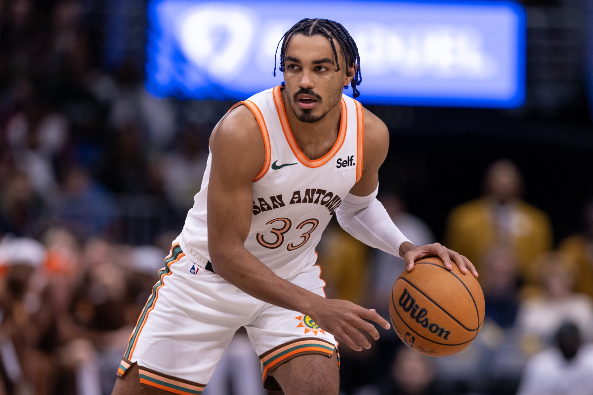Dec 1, 2023; New Orleans, Louisiana, USA; San Antonio Spurs guard Tre Jones (33) brings the ball up court against the New Orleans Pelicans during the second half at the Smoothie King Center.