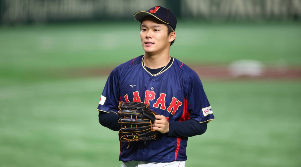 Team Japan pitcher Yoshinobu Yamamoto walks off the mound during a World Baseball Classic game.