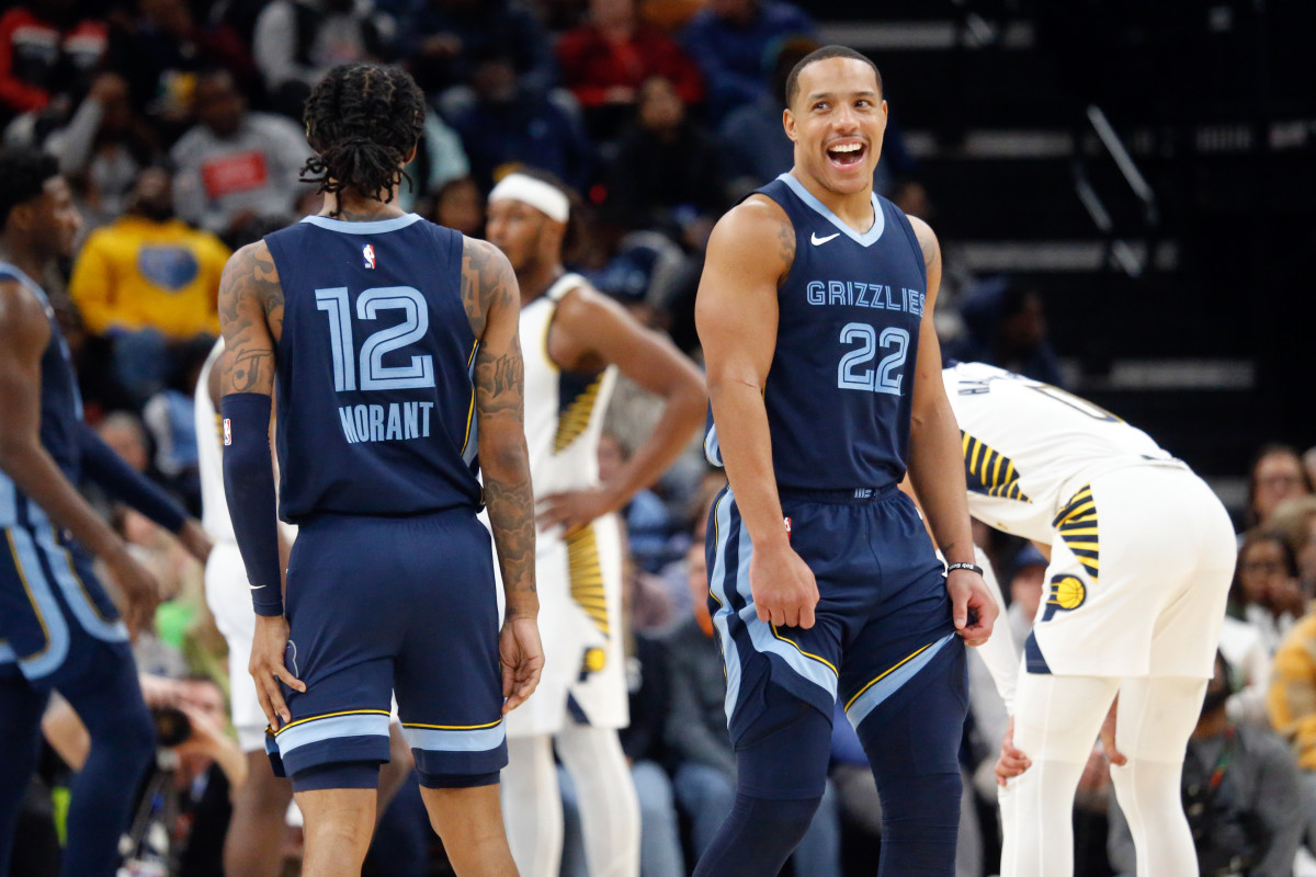 Dec 21, 2023; Memphis, Tennessee, USA; Memphis Grizzlies guard Desmond Bane (22) reacts with guard Ja Morant (12) during the second half against the Indiana Pacers at FedExForum. Mandatory Credit: Petre Thomas-USA TODAY Sports