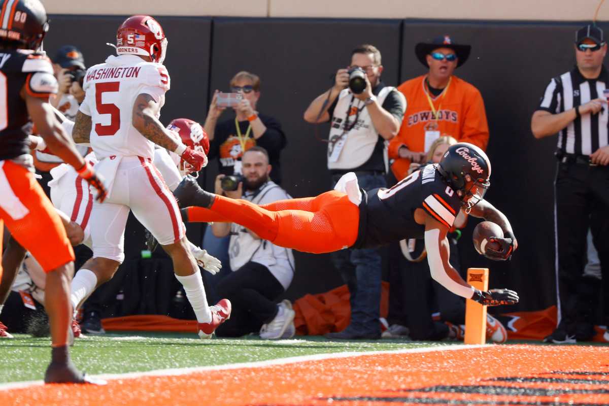 Oklahoma State Cowboys running back Ollie Gordon II (0) dives for a touchdown during a Bedlam college football game between the Oklahoma State University Cowboys (OSU) and the University of Oklahoma Sooners (OU) at Boone Pickens Stadium in Stillwater, Okla., Saturday, Nov. 4, 2023.
