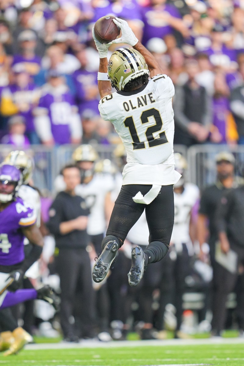 New Orleans Saints wide receiver Chris Olave (12) catches a pass against the Minnesota Vikings. Mandatory Credit: Brad Rempel-USA TODAY Sports