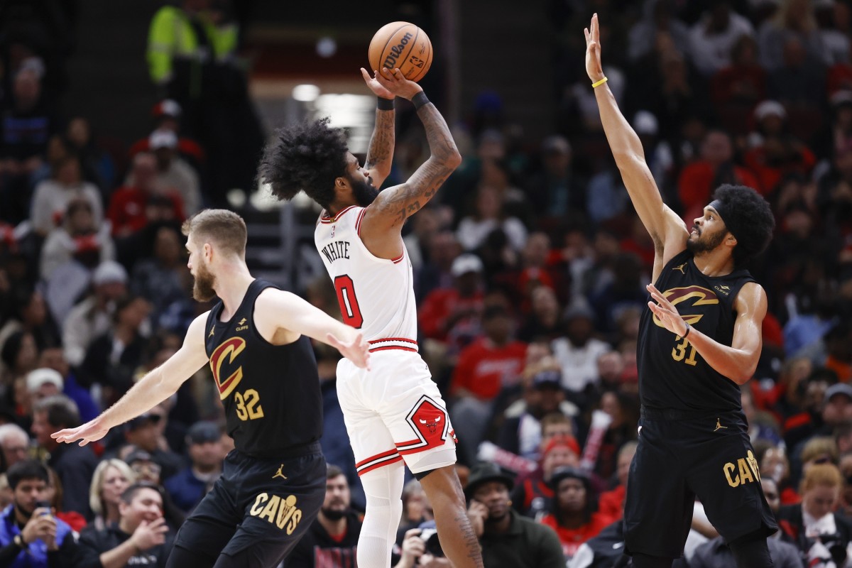 Chicago Bulls guard Coby White (0) shoots against Cleveland Cavaliers center Jarrett Allen (31) during the second half at United Center.