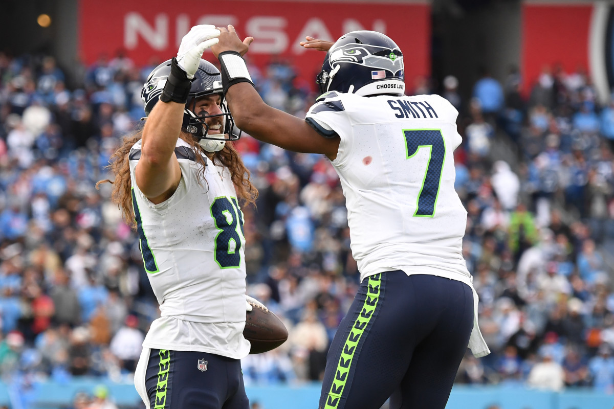 Seattle Seahawks tight end Colby Parkinson (84) celebrates with quarterback Geno Smith (7) after scoring the game-winning touchdown during the second half against the Tennessee Titans at Nissan Stadium.