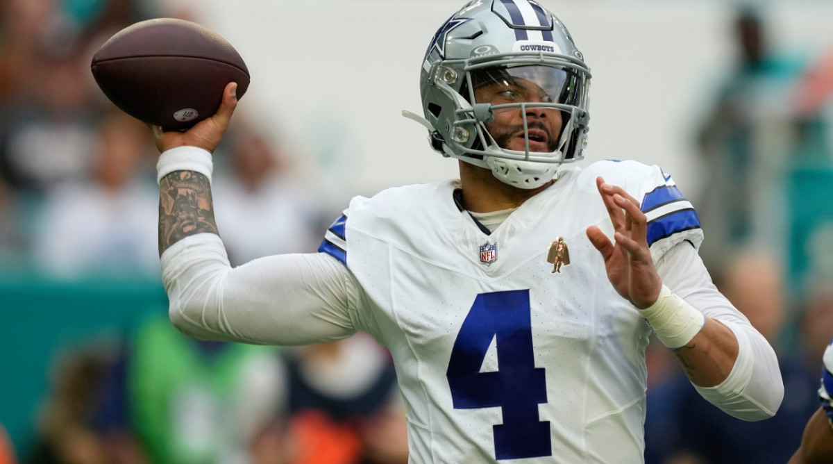 Dallas Cowboys quarterback Dak Prescott (4) stands back to pass during the first half of an NFL football game against the Miami Dolphins, Sunday, Dec. 24, 2023, in Miami Gardens, Fla. (AP Photo/Rebecca Blackwell)   