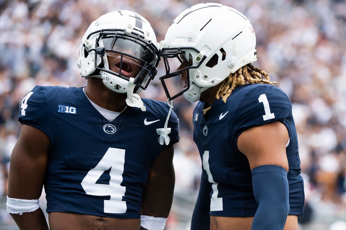 Penn State cornerback Kalen King (4) celebrates with safety Jaylen Reed (1) after Reed intercepted a pass in the first half of an NCAA football game against Indiana Saturday, Oct. 28, 2023, in State College, Pa. The Nittany Lions won, 33-24.  