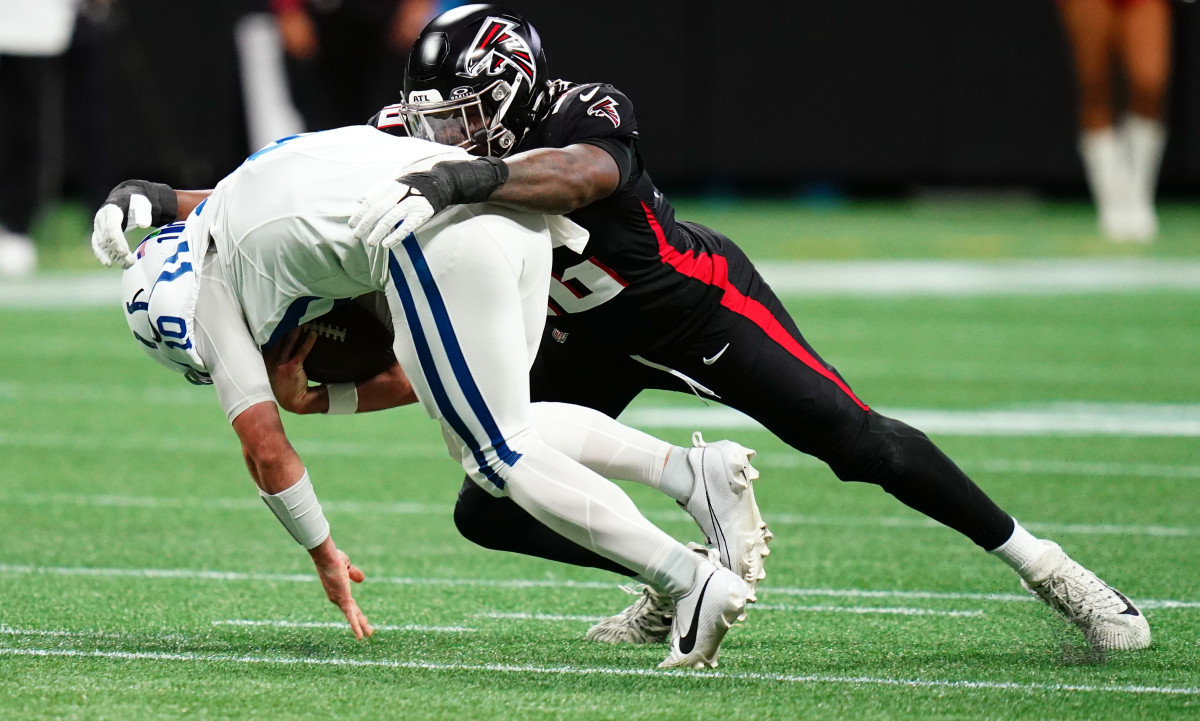 Atlanta Falcons defensive end Zach Harrison (96) takes down Indianapolis Colts quarterback Gardner Minshew (10) during the first half at Mercedes-Benz Stadium.
