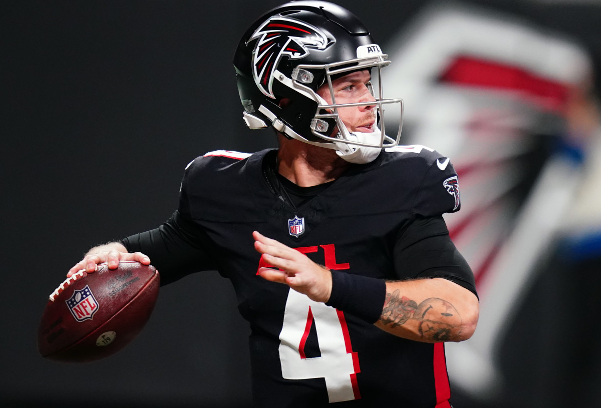 Atlanta Falcons quarterback Taylor Heinicke (4) drops back to pass against the Indianapolis Colts during the first half at Mercedes-Benz Stadium.