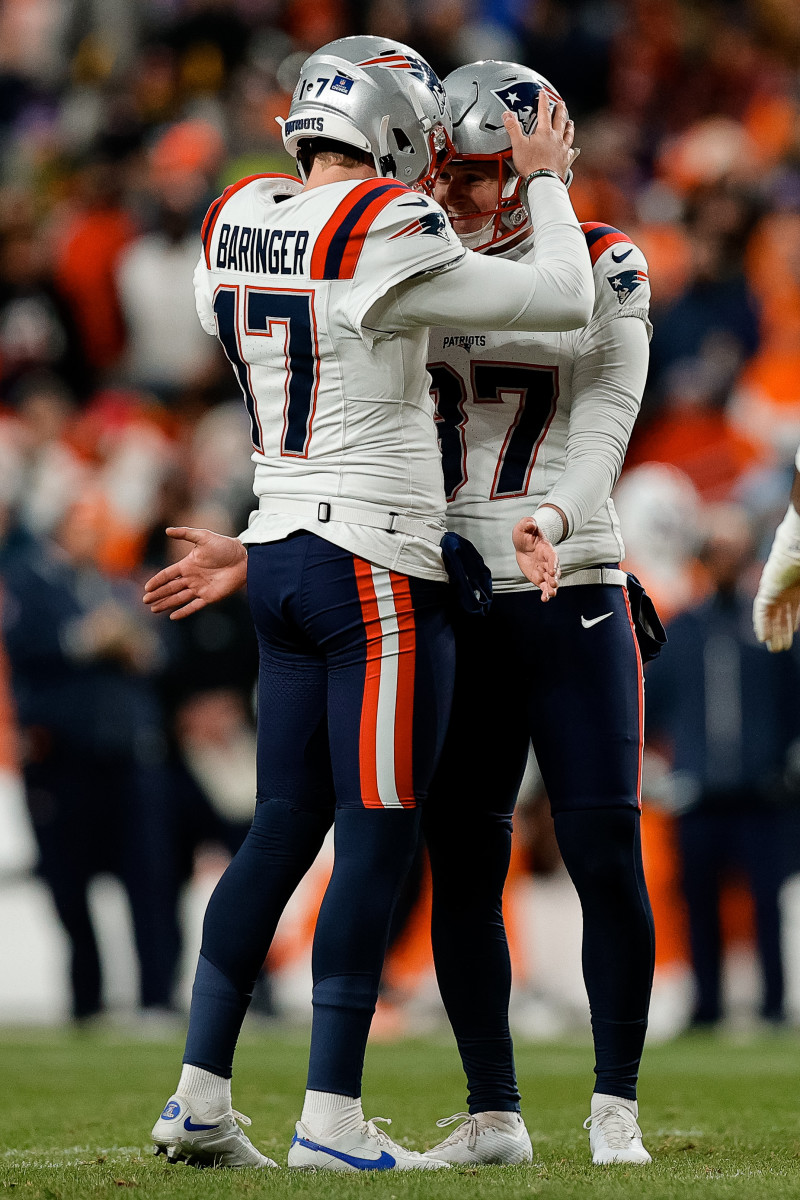 New England Patriots place kicker Chad Ryland (37) reacts with punter Bryce Baringer (17) after a field goal in the second quarter against the Denver Broncos at Empower Field at Mile High.