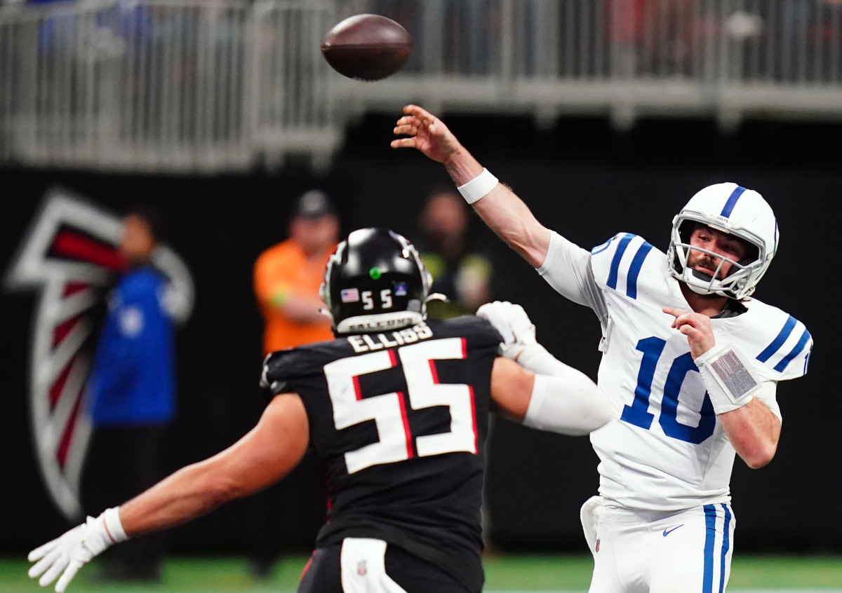 Indianapolis Colts quarterback Gardner Minshew (10) passing under pressure from Atlanta Falcons linebacker Kaden Elliss (55) during the second half at Mercedes-Benz Stadium.