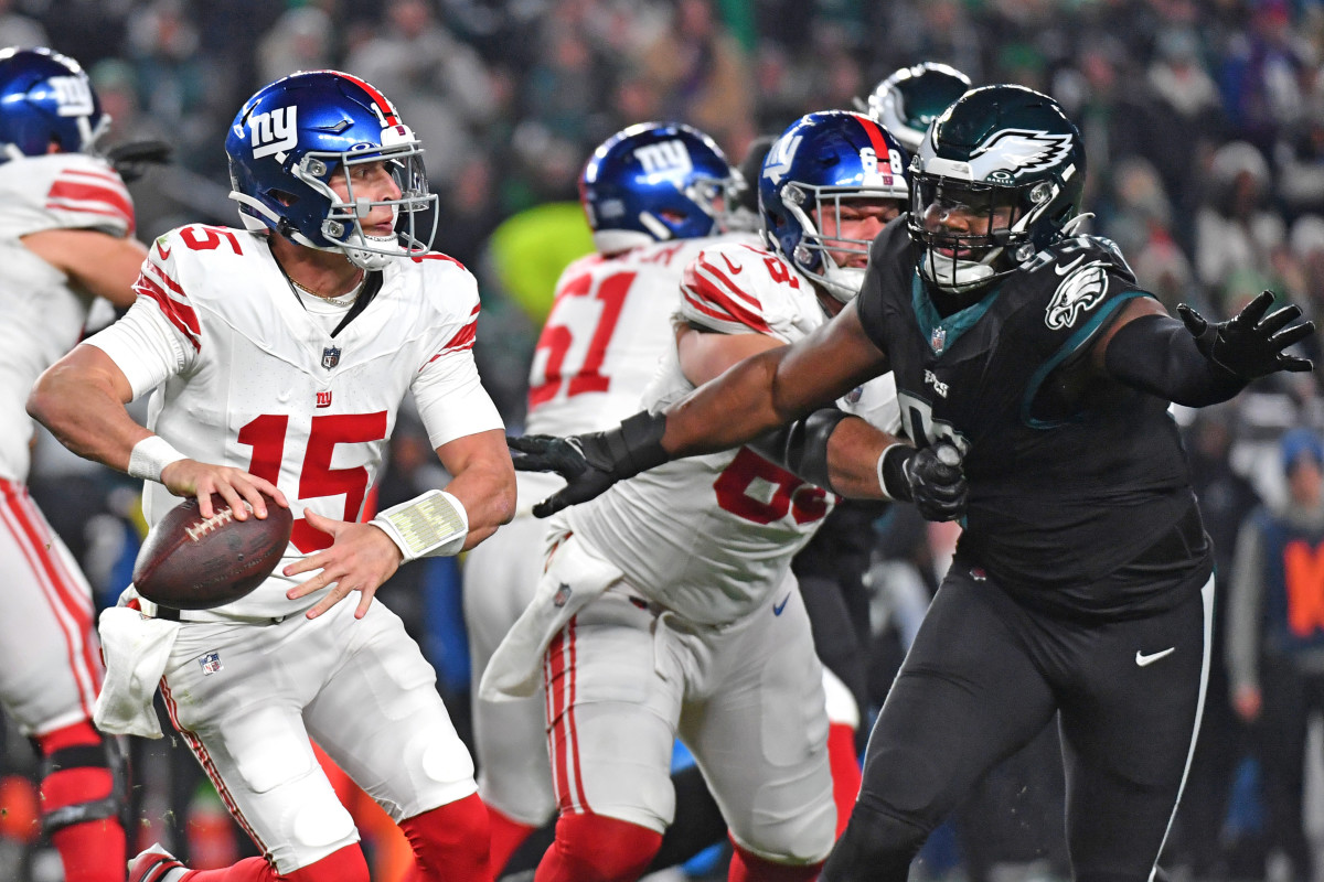 New York Giants quarterback Tommy DeVito is pressured by Philadelphia Eagles defensive tackle Milton Williams during the second quarter at Lincoln Financial Field.