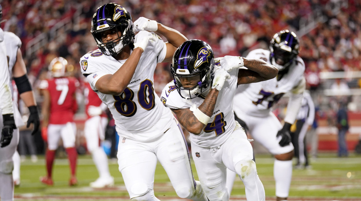 Ravens wide receiver Zay Flowers, right, celebrates with tight end Isaiah Likely after catching a touchdown