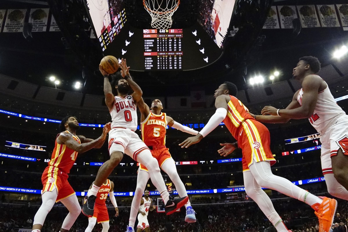 Atlanta Hawks guard Dejounte Murray (5) defends Chicago Bulls guard Coby White (0) during the second half at United Center.