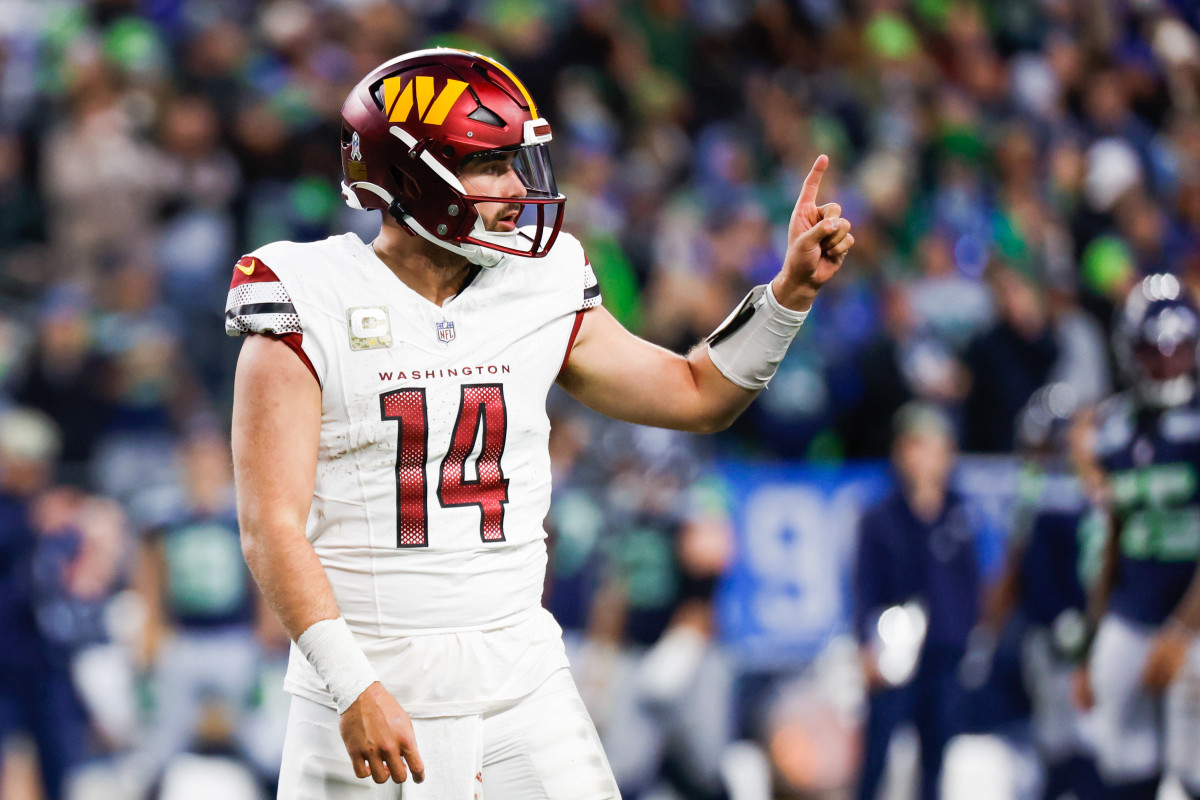 Nov 12, 2023; Seattle, Washington, USA; Washington Commanders quarterback Sam Howell (14) signals to the sideline during the fourth quarter against the Seattle Seahawks at Lumen Field.