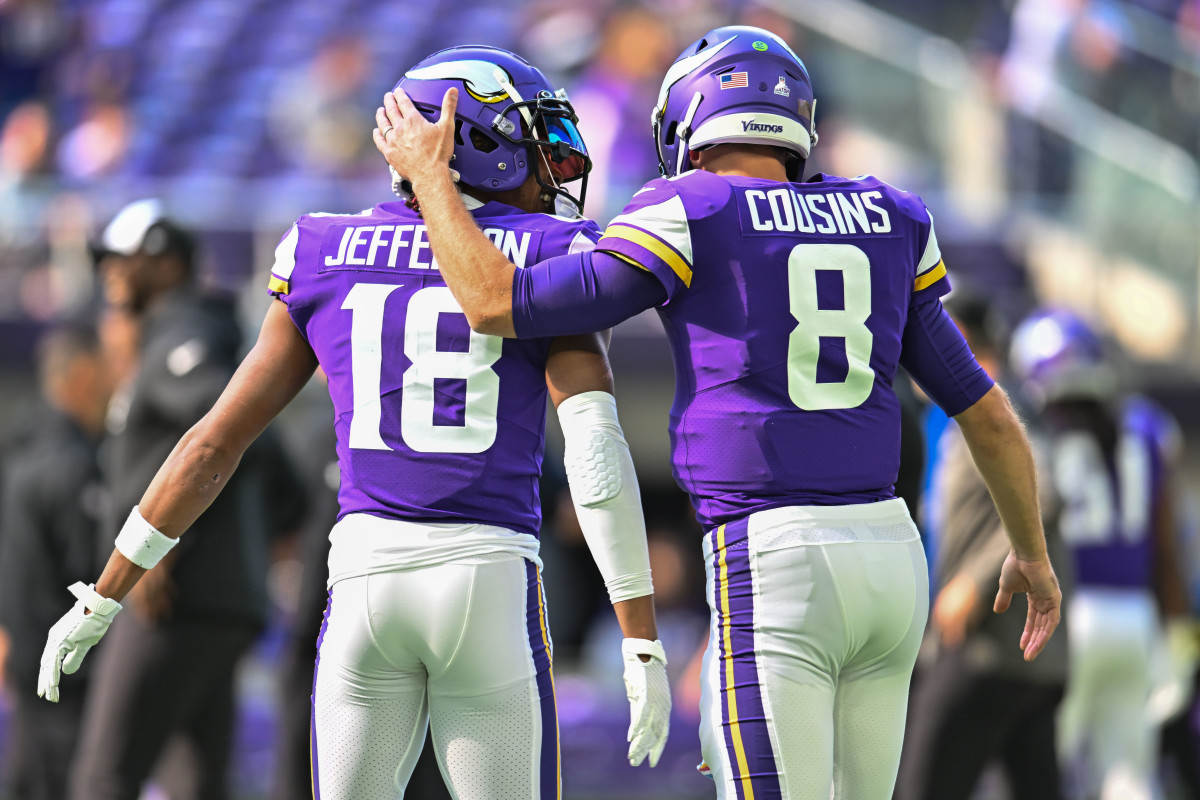 Oct 9, 2022; Minneapolis, Minnesota, USA; Minnesota Vikings wide receiver Justin Jefferson (18) and quarterback Kirk Cousins (8) warm up before the game against the Chicago Bears at U.S. Bank Stadium.