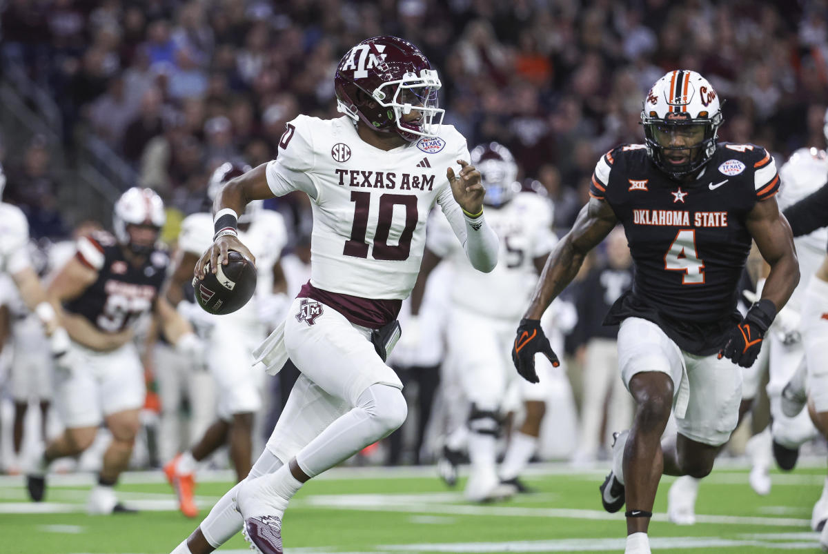 Dec 27, 2023; Houston, TX, USA; Texas A&M Aggies quarterback Marcel Reed (10) runs with the ball as Oklahoma State Cowboys linebacker Nickolas Martin (4) attempts to make a tackle during the first quarter at NRG Stadium.