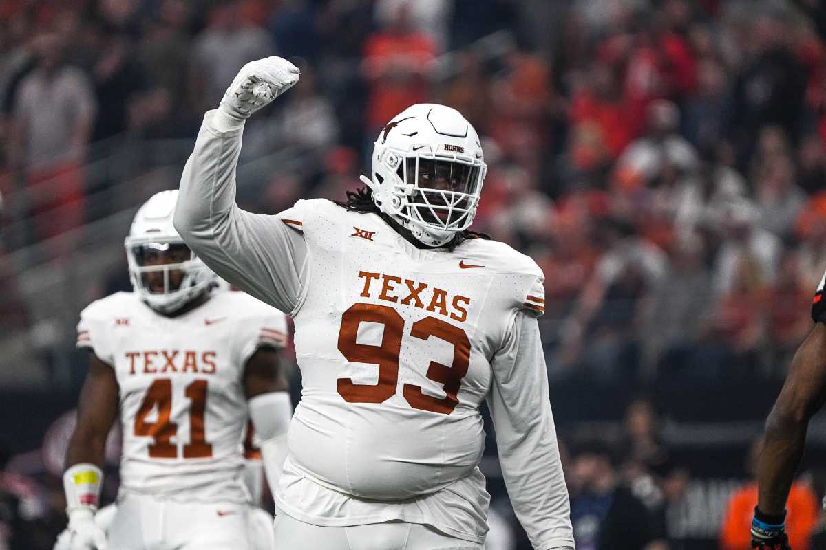 Texas Longhorns defensive lineman T'Vondre Sweat (93) celebrates a defensive stop during the Big 12 Championship game against the Oklahoma State Cowboys at AT&T stadium on Saturday, Dec. 2, 2023 in Arlington.  