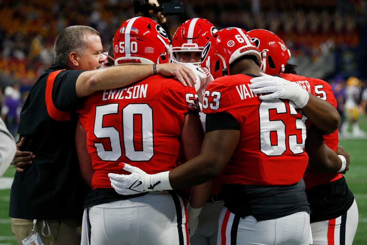 Georgia Offensive Line Coach Stacy Searels huddles up his players before the start of the SEC Championship NCAA college football game between LSU and Georgia in Atlanta, on Saturday, Dec. 3, 2022. News Joshua L Jones
