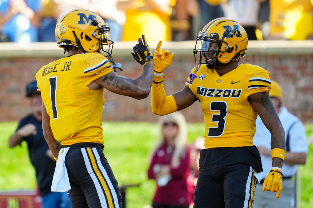 Oct 21, 2023; Columbia, Missouri, USA; Missouri Tigers wide receiver Luther Burden III (3) celebrates with wide receiver Theo Wease Jr. (1) after scoring a touchdown against the South Carolina Gamecocks during the first half at Faurot Field at Memorial Stadium. Mandatory Credit: Jay Biggerstaff-USA TODAY Sports  
