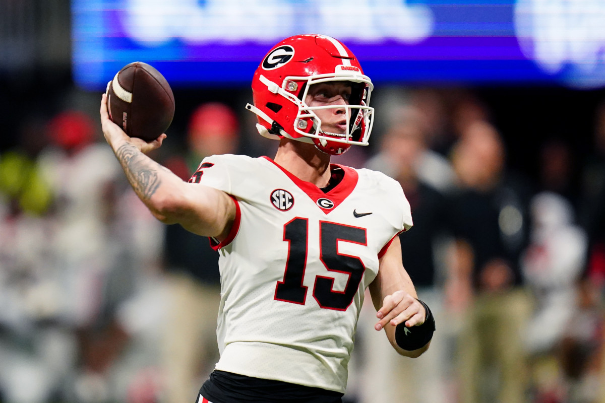 Dec 2, 2023; Atlanta, GA, USA; Georgia Bulldogs quarterback Carson Beck (15) throws a pass against the Alabama Crimson Tide in the third quarter of the SEC Championship at Mercedes-Benz Stadium. Mandatory Credit: John David Mercer-USA TODAY Sports  