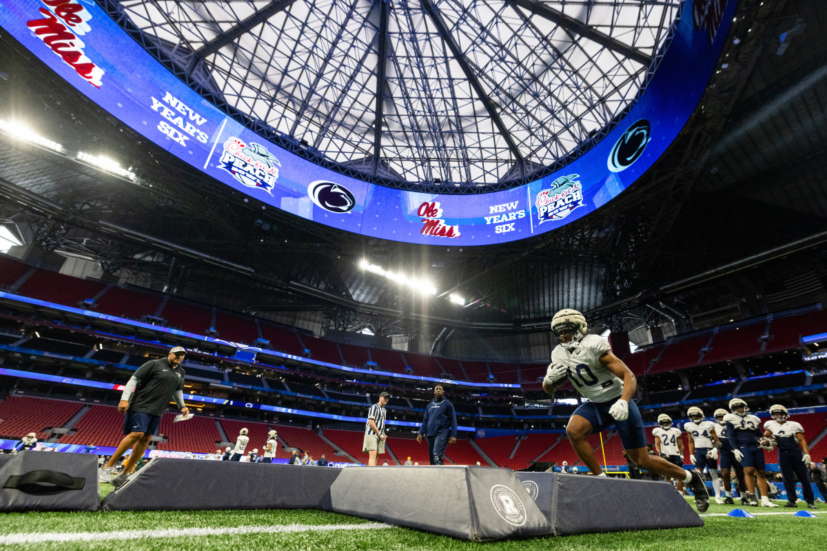 Penn State running back Nicholas Singleton runs through a drill during Peach Bowl practice at Mercedes-Benz Stadium in Atlanta.