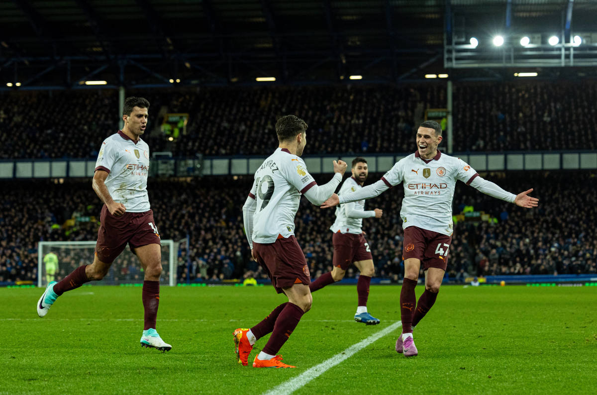 Manchester City players pictured celebrating following a goal scored by Julian Alvarez (center) during a 3-1 win at Everton in December 2023