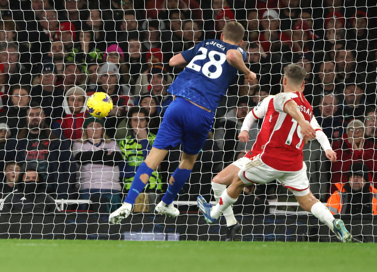 Tomas Soucek pictured (center) shooting to score for West Ham United against Arsenal in a Premier League game at the Emirates Stadium in December 2023