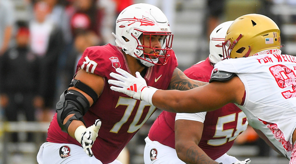 Florida State lineman Casey Roddick blocks a Boston player at the line of scrimmage.
