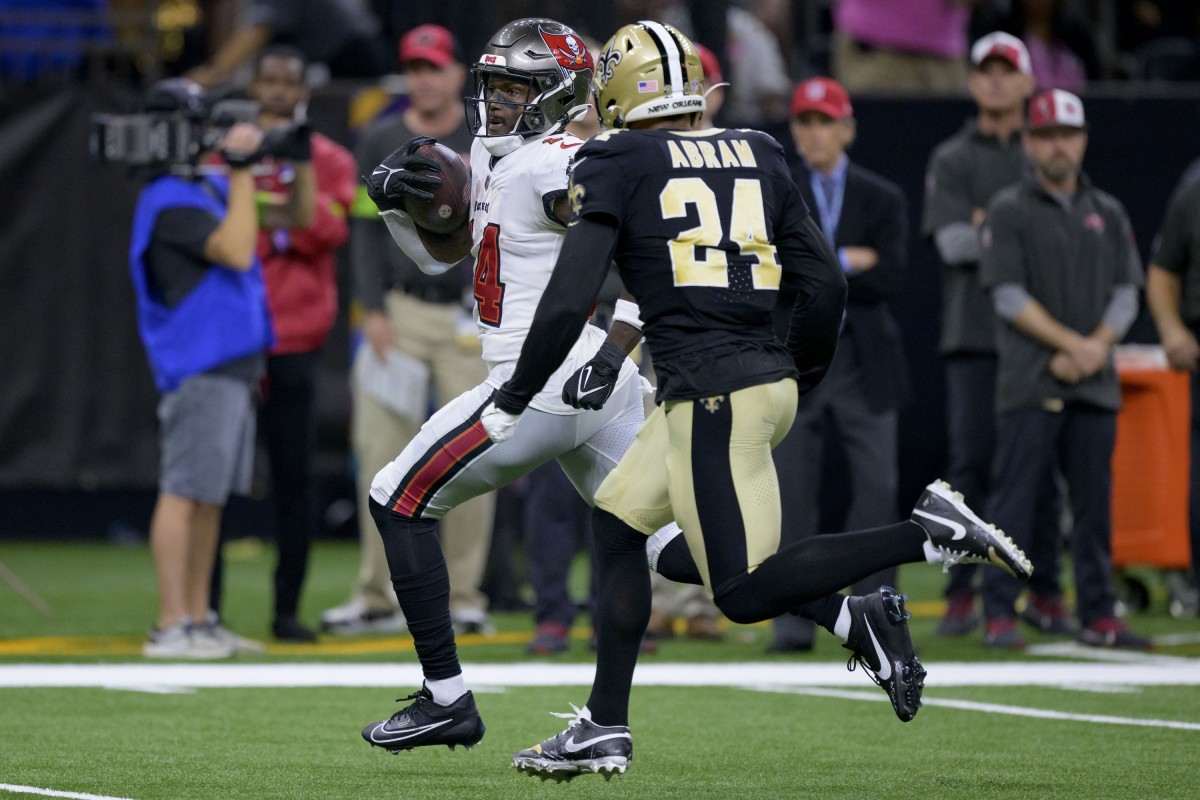 Oct 1, 2023; Tampa Bay Buccaneers wide receiver Chris Godwin (14) runs past New Orleans Saints safety Johnathan Abram (24) after a reception. Mandatory Credit: Matthew Hinton-USA TODAY