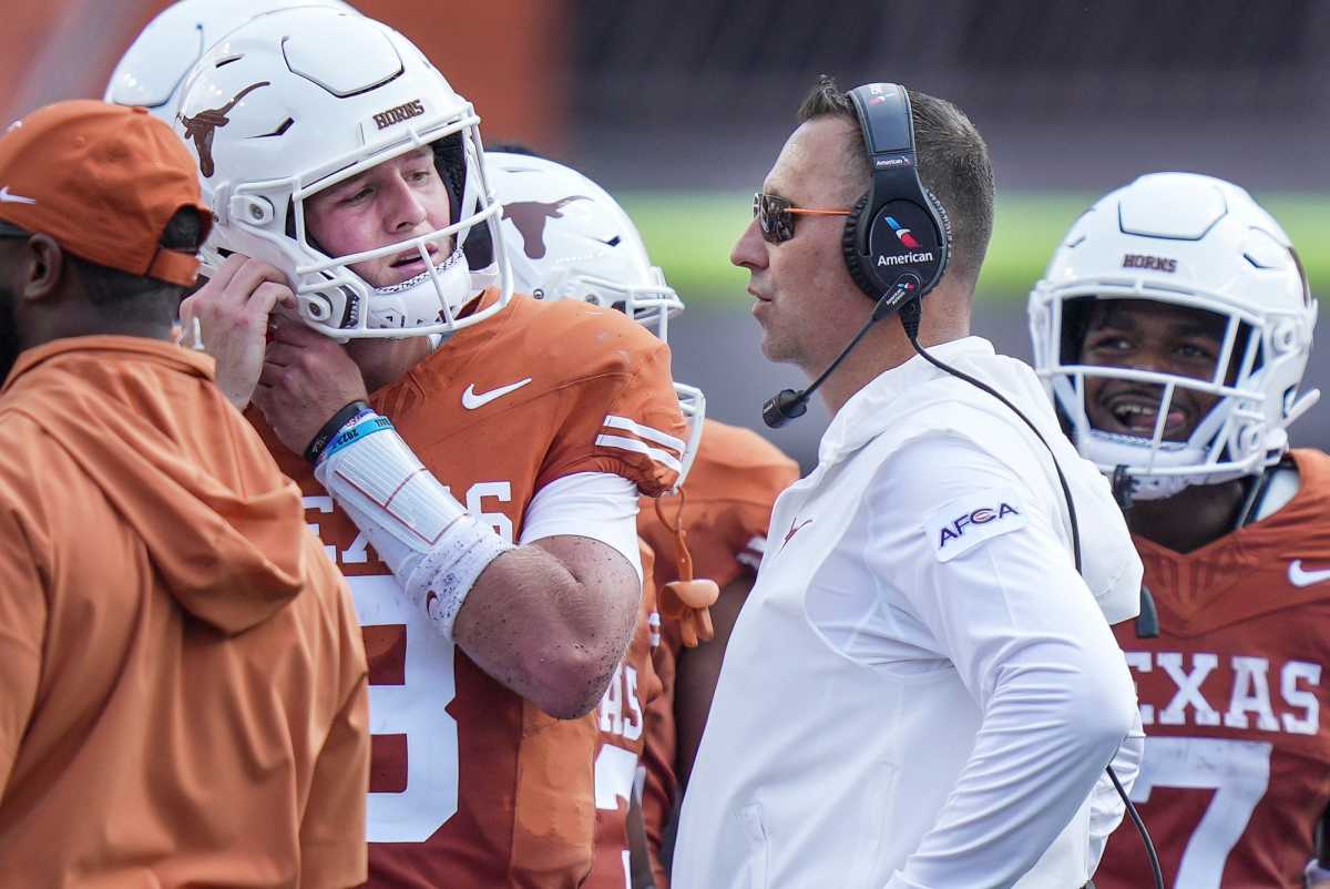 Texas Longhorns head coach Steve Sarkisian talks with Texas Longhorns quarterback Quinn Ewers (3) during a timeout in the first half of an NCAA college football game, Saturday, Sept. 2, 2023, in Austin, Texas.