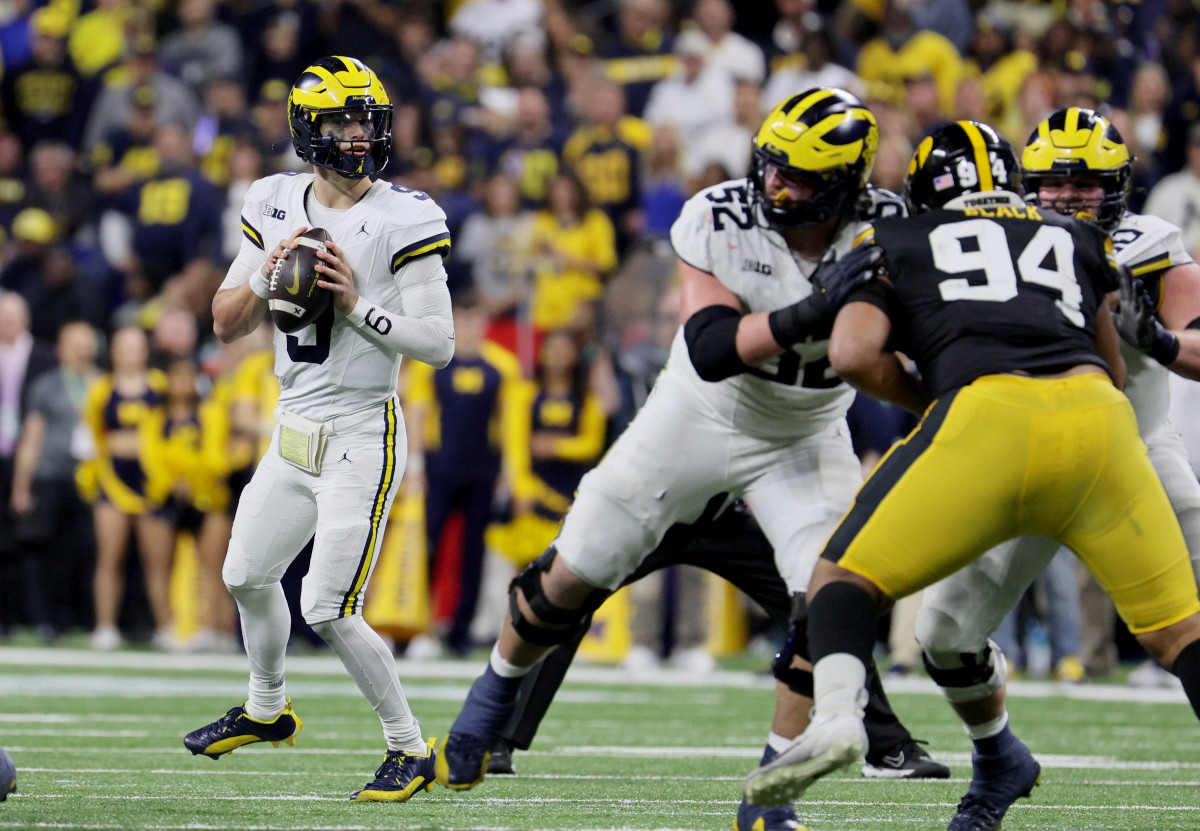 Michigan quarterback J.J. McCarthy drops back to pass against Iowa.
