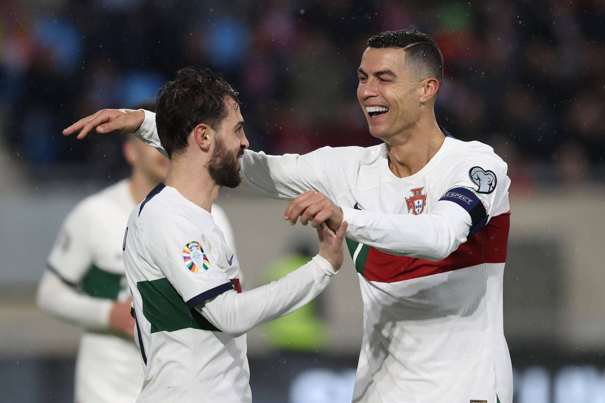 Cristiano Ronaldo (right) and Bernardo Silva pictured celebrating a goal for Portugal during a 6-0 away win against Luxembourg in March 2023