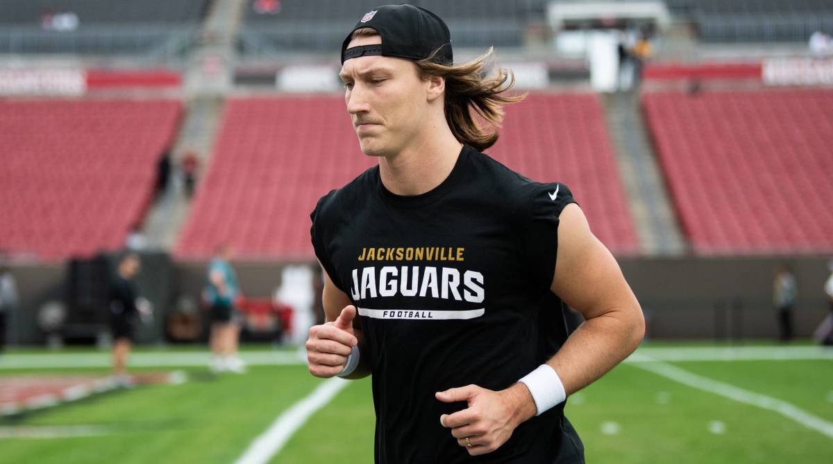 Jaguars quarterback Trevor Lawrence jogs during warmups before a game.