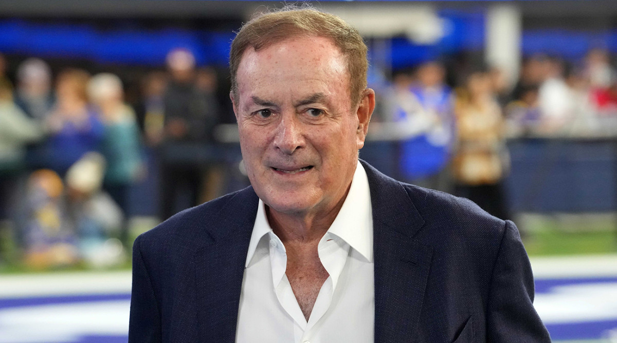Al Michaels walks on the field before a game in Los Angeles.