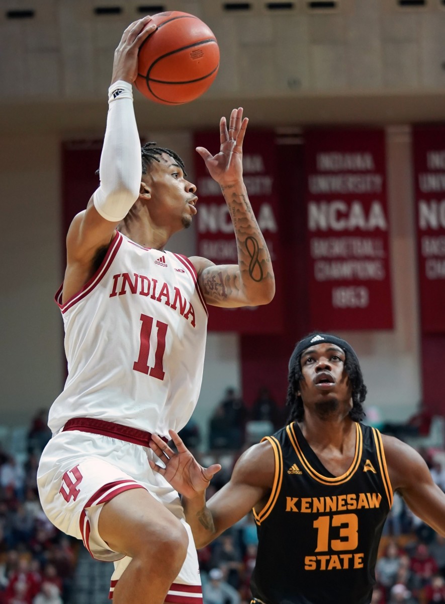 Indiana Hoosiers guard CJ Gunn (11) passes the ball over Kennesaw State Owls guard Kasen Jennings (13) during the first half at Simon Skjodt Assembly Hall. Mandatory Credit: Robert Goddin-USA TODAY Sports