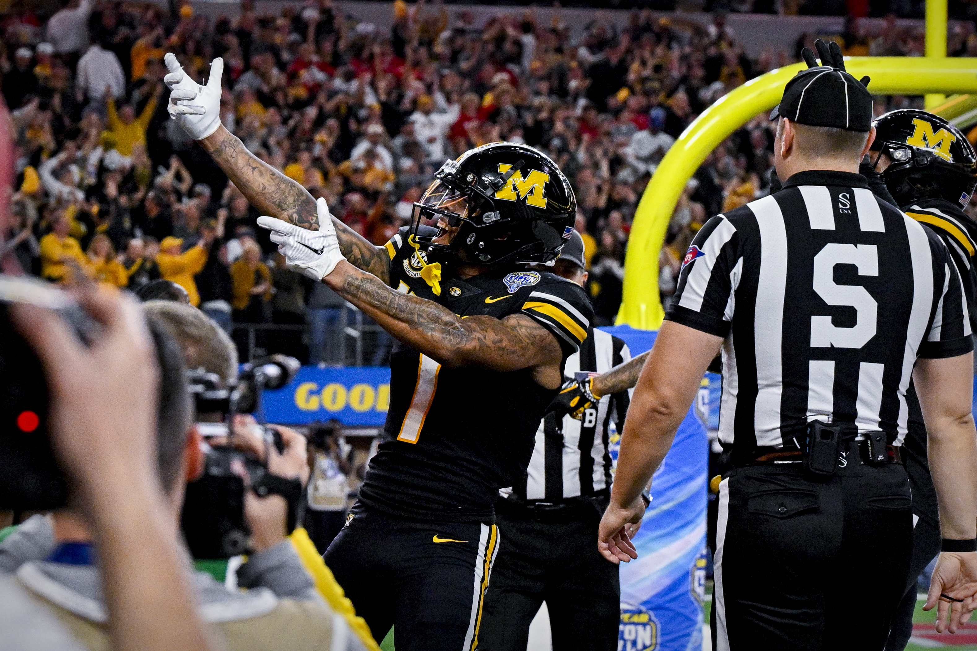 Missouri Tigers wide receiver Theo Wease Jr. (1) celebrates after wide receiver Luther Burden III (3) catches a pass for a touchdown against the Ohio State Buckeyes during the fourth quarter at AT&T Stadium.