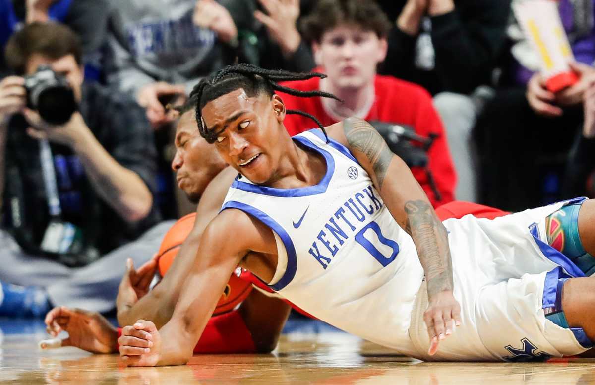 Kentucky Wildcats guard Rob Dillingham (0) battles Illinois State Redbirds forward Myles Foster (4) for control in the first half at Rupp Arena Friday night in Lexington, Ky. Dec. 29, 2023
