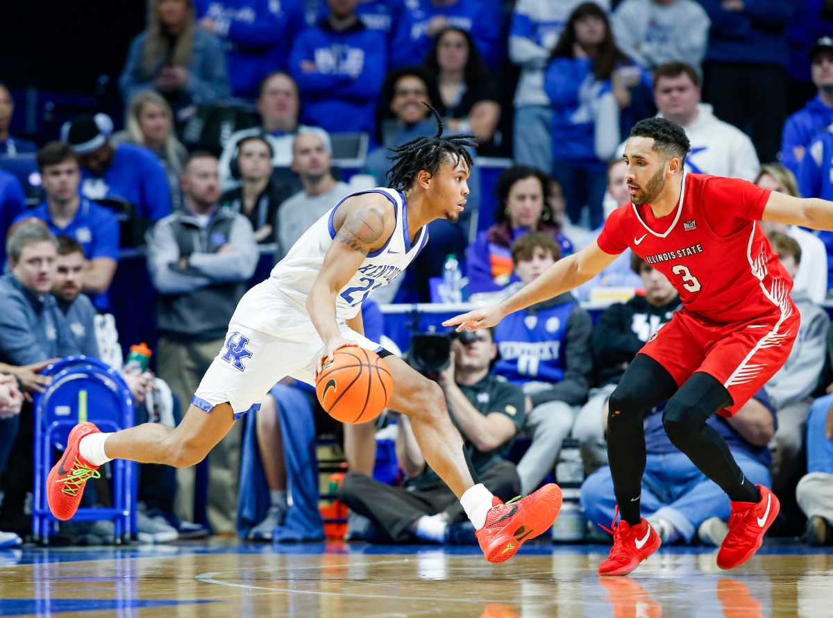 Kentucky Wildcats guard D.J. Wagner (21) looks to drive on Illinois State Redbirds guard Dalton Banks (3) in the second half Friday in the Wildcats' win over the Redbirds. Dec. 29, 2023