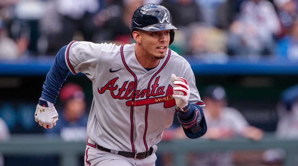 Atlanta Braves infielder Vaughn Grissom runs to first base after getting a hit during a game against the Kansas City Royals.