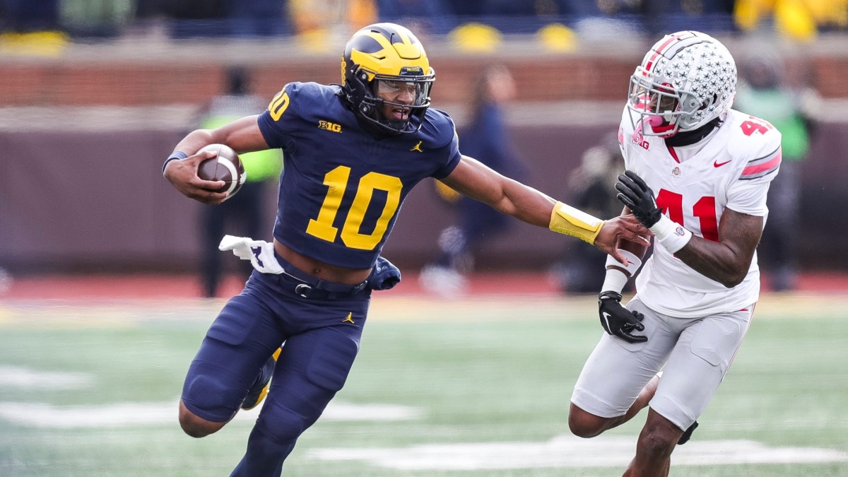 Michigan quarterback Alex Orji runs against Ohio State.